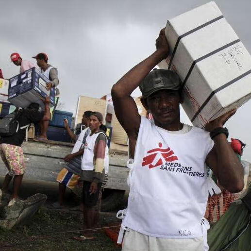 A Doctor without Borders volunteer carrying supplies to people of need