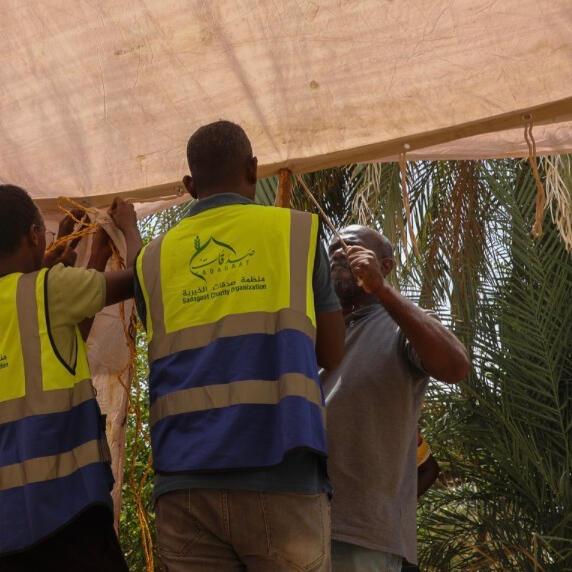 Sadagaat volunteers helps set up shelter